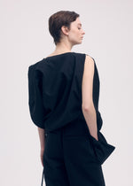 A model wears the ISSEY MIYAKE PAPER BAG shirt.