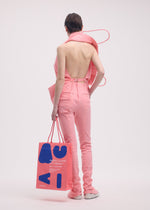 A model wears the ISSEY MIYAKE PAPER BAG (POSTER) shirt.