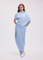 A model wears the ISSEY MIYAKE SOFT FOLD PLEATS shirt.