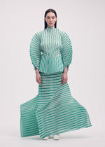A model wears the ISSEY MIYAKE GENERIC STRIPES (HAND PLEATS) clothing.