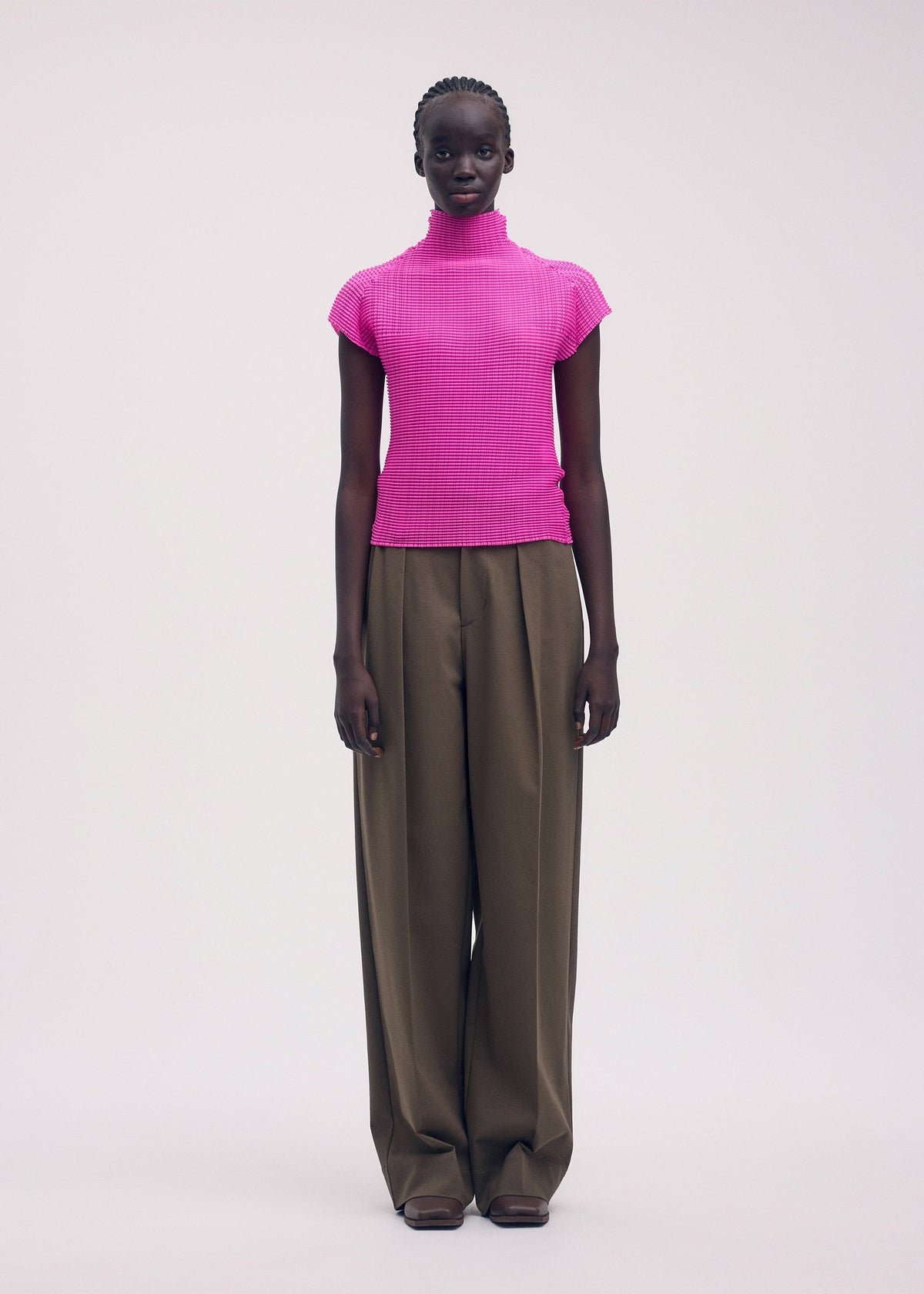 A model wears the ISSEY MIYAKE WOOLY PLEATS 58 shirt.