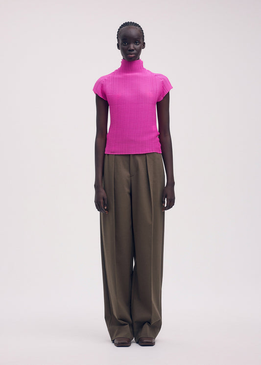 A model wears the ISSEY MIYAKE WOOLY PLEATS 58 shirt.
