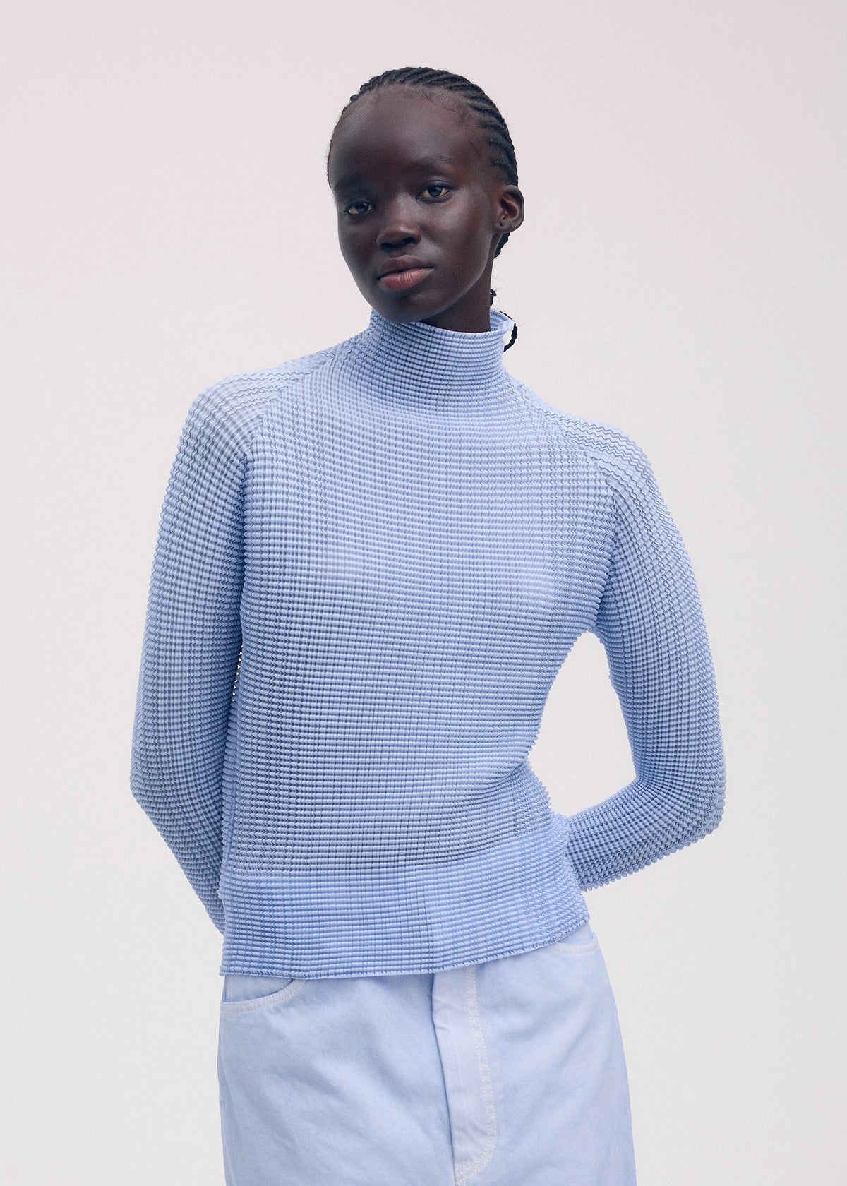 A model wears the ISSEY MIYAKE WOOLY PLEATS 58 shirt.