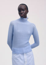 A model wears the ISSEY MIYAKE WOOLY PLEATS 58 shirt.