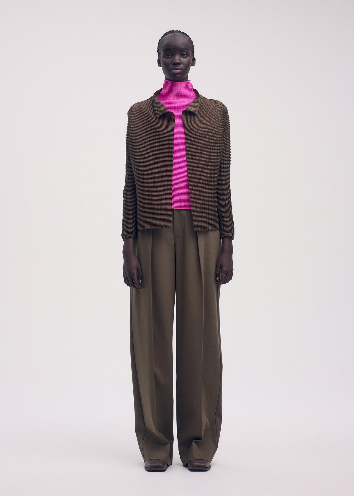 A model wears the ISSEY MIYAKE WOOLY PLEATS 58 shirt.