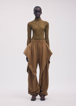 A model wears the ISSEY MIYAKE CHIFFON TWIST 3 clothing.