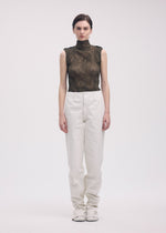 A model wears the ISSEY MIYAKE CHIFFON TWIST 1 top.