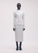 A model wears the ISSEY MIYAKE SLEEK PLEATS cardigan.