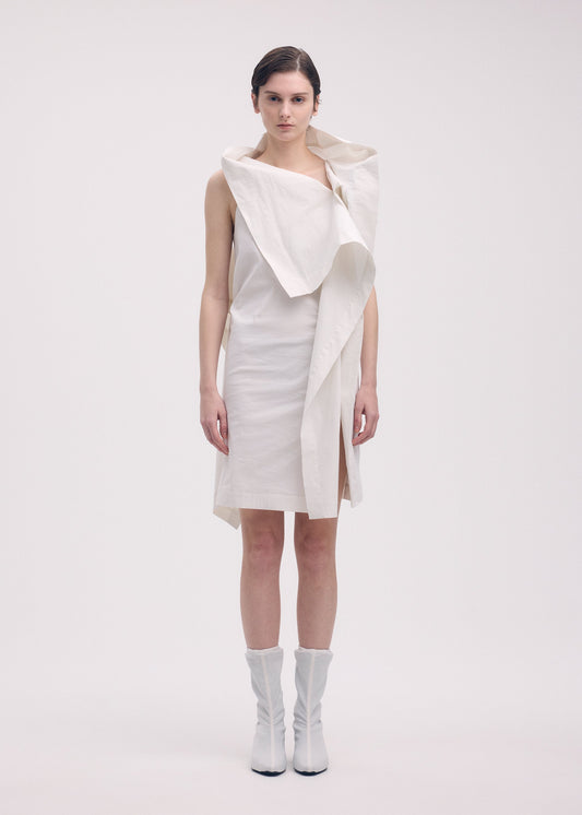 A model wears the ISSEY MIYAKE COLLAPSING SCULPTURE tunic.