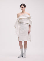 A model wears the ISSEY MIYAKE COLLAPSING SCULPTURE tunic.