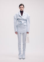 A model wears the ISSEY MIYAKE LIKE TORSO LIKE BLAZER tunic.