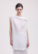 A model wears the ISSEY MIYAKE PAPER BAG PLEATS tunic.