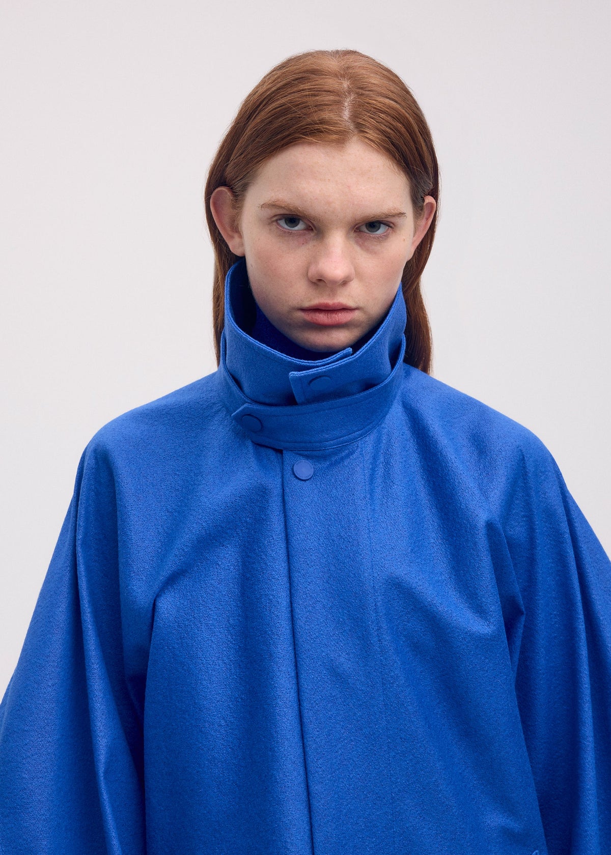 A model wears the ISSEY MIYAKE HANG OR CARRY coat.