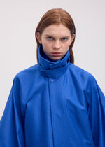 A model wears the ISSEY MIYAKE HANG OR CARRY coat.