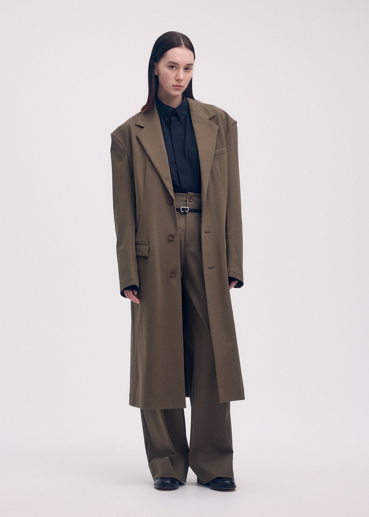 A model wears the ISSEY MIYAKE SIMPLE ENSEMBLE jacket.