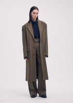 A model wears the ISSEY MIYAKE SIMPLE ENSEMBLE jacket.