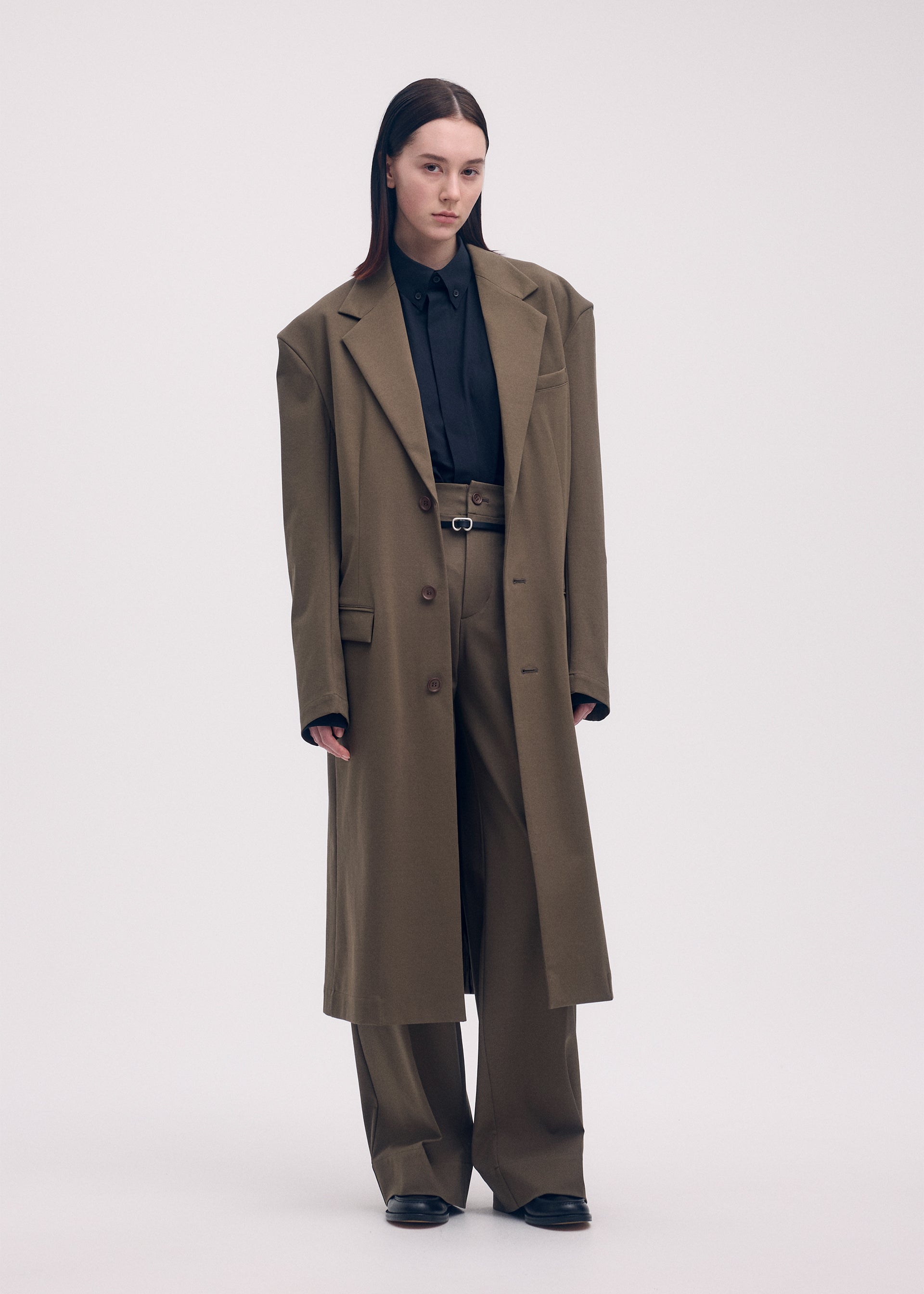 A model wears the ISSEY MIYAKE SIMPLE ENSEMBLE jacket.