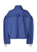 A detail shot of the ISSEY MIYAKE HANG OR CARRY jacket.