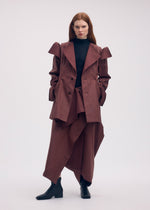 A model wears the ISSEY MIYAKE LEFT UNDONE jacket.