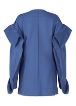 A detail shot of the ISSEY MIYAKE LEFT UNDONE jacket.