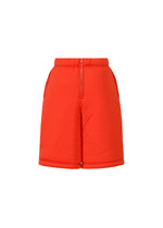 A detail shot of the ISSEY MIYAKE PUMPED T trousers.