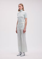A model wears the ISSEY MIYAKE HANG OR CARRY trousers.