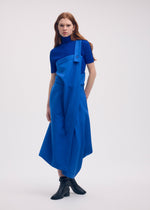 A model wears the ISSEY MIYAKE LEFT UNDONE trousers.