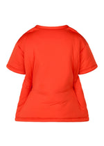 A detail shot of the ISSEY MIYAKE PUMPED T top.