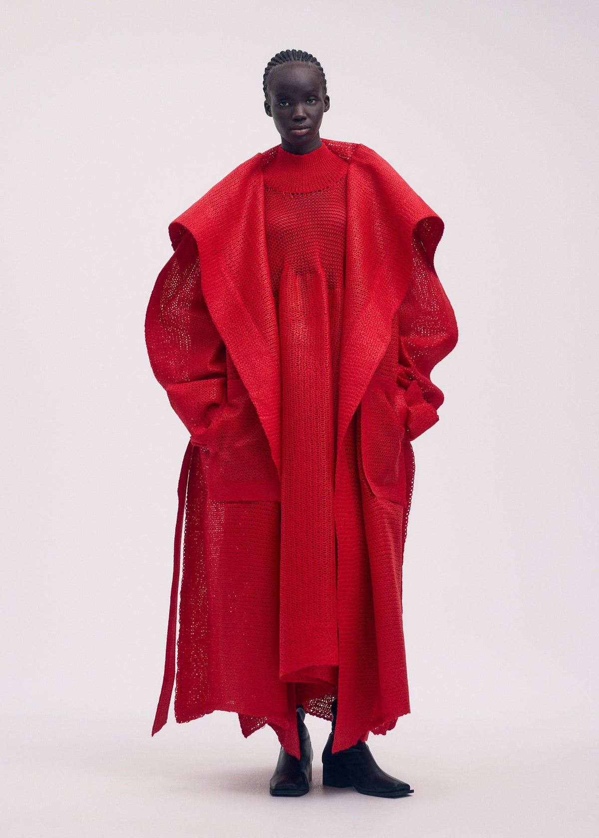 A model wears the ISSEY MIYAKE PANINI coat.