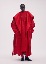 A model wears the ISSEY MIYAKE PANINI coat.
