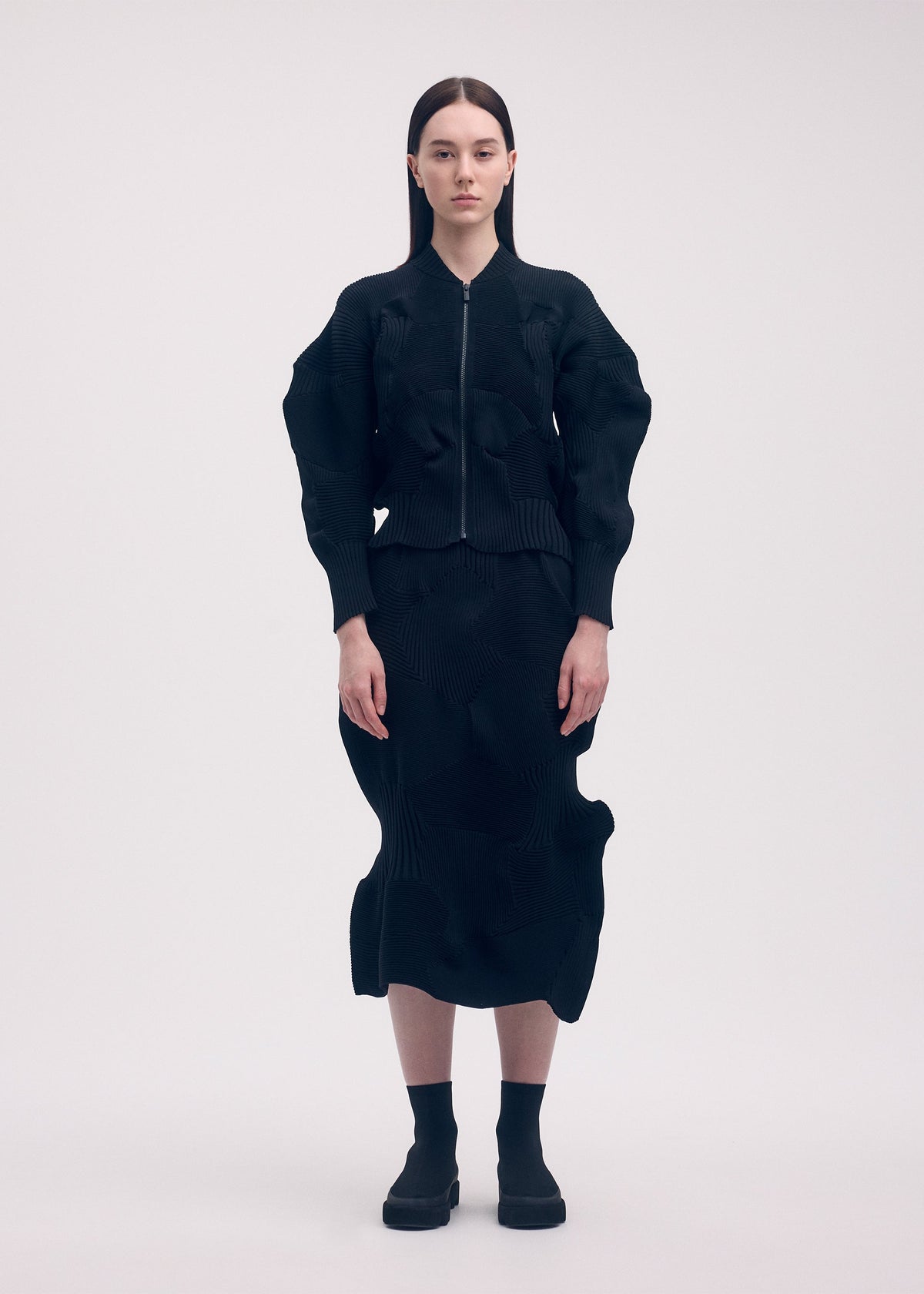 A model wears the ISSEY MIYAKE KONE KONE jacket.