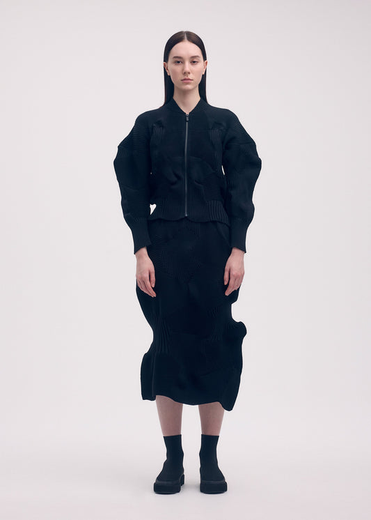 A model wears the ISSEY MIYAKE KONE KONE jacket.