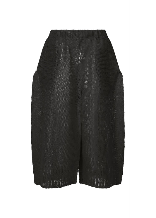 A product shot of the ISSEY MIYAKE PANINI trousers in black (15).