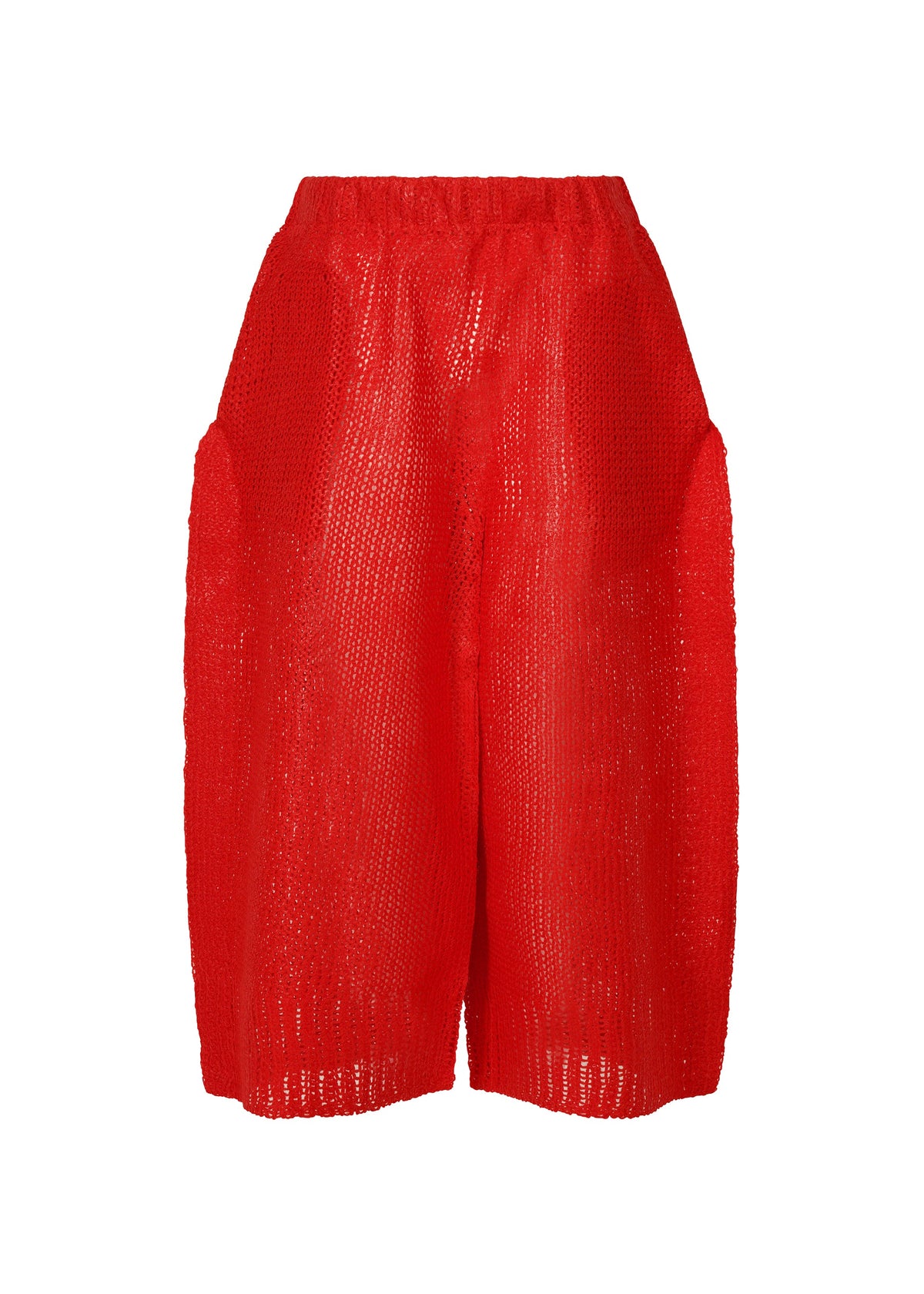 A product shot of the ISSEY MIYAKE PANINI trousers in red (24).