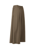A detail shot of the ISSEY MIYAKE CAMPAGNE trousers.