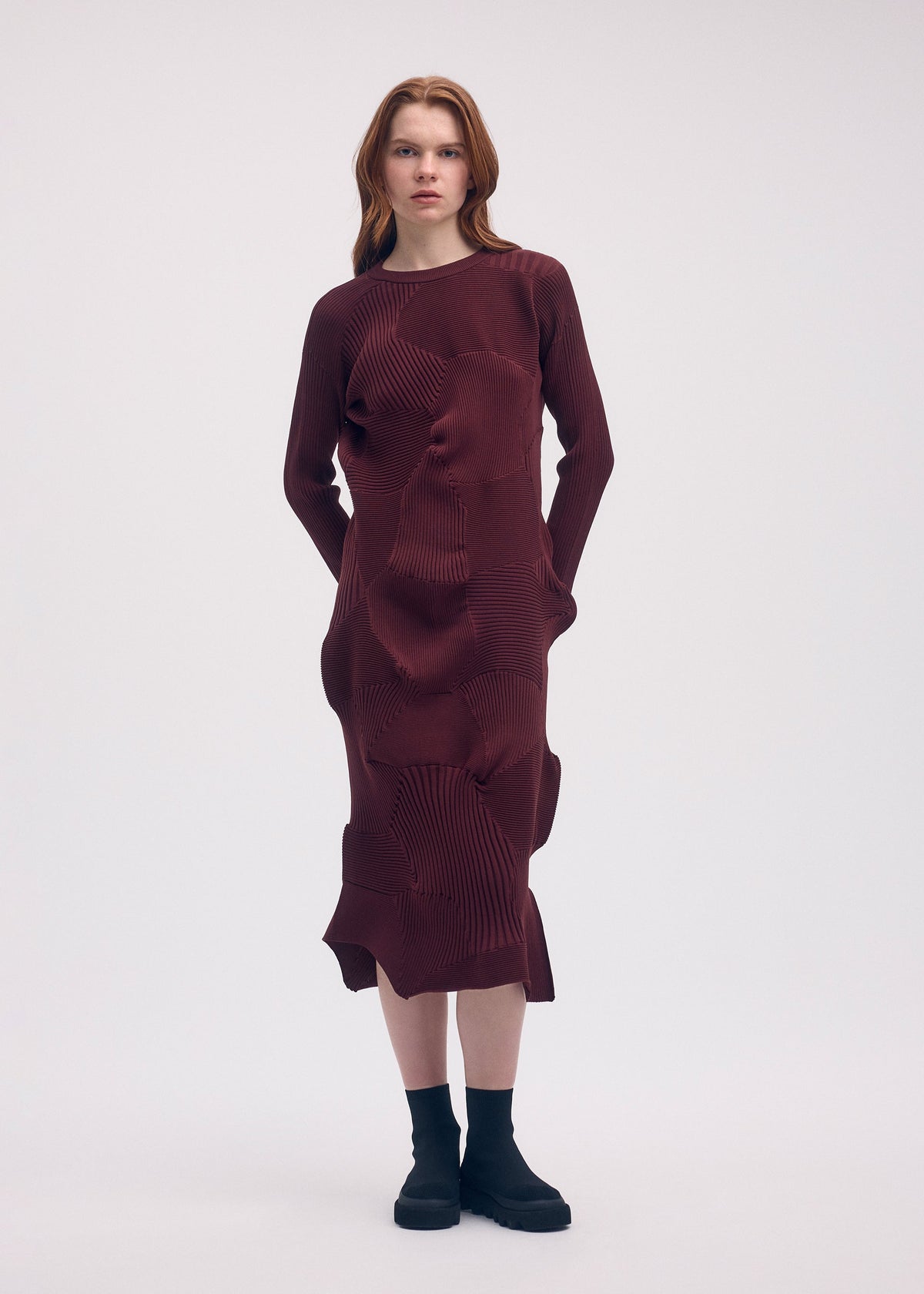 A model wears the ISSEY MIYAKE KONE KONE dress.