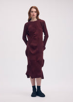 A model wears the ISSEY MIYAKE KONE KONE dress.