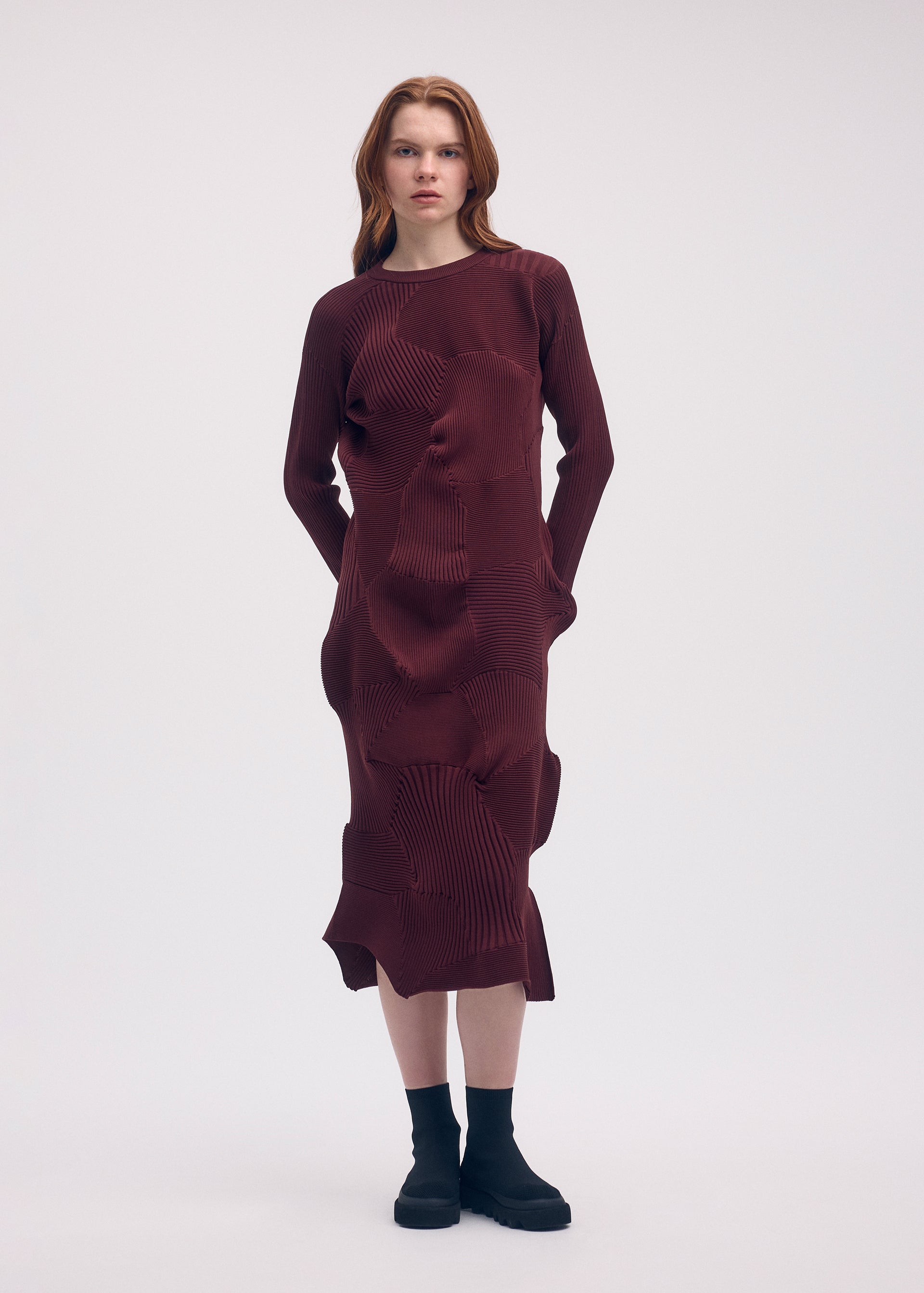 A model wears the ISSEY MIYAKE KONE KONE dress.