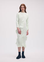 A model wears the ISSEY MIYAKE KONE KONE dress.