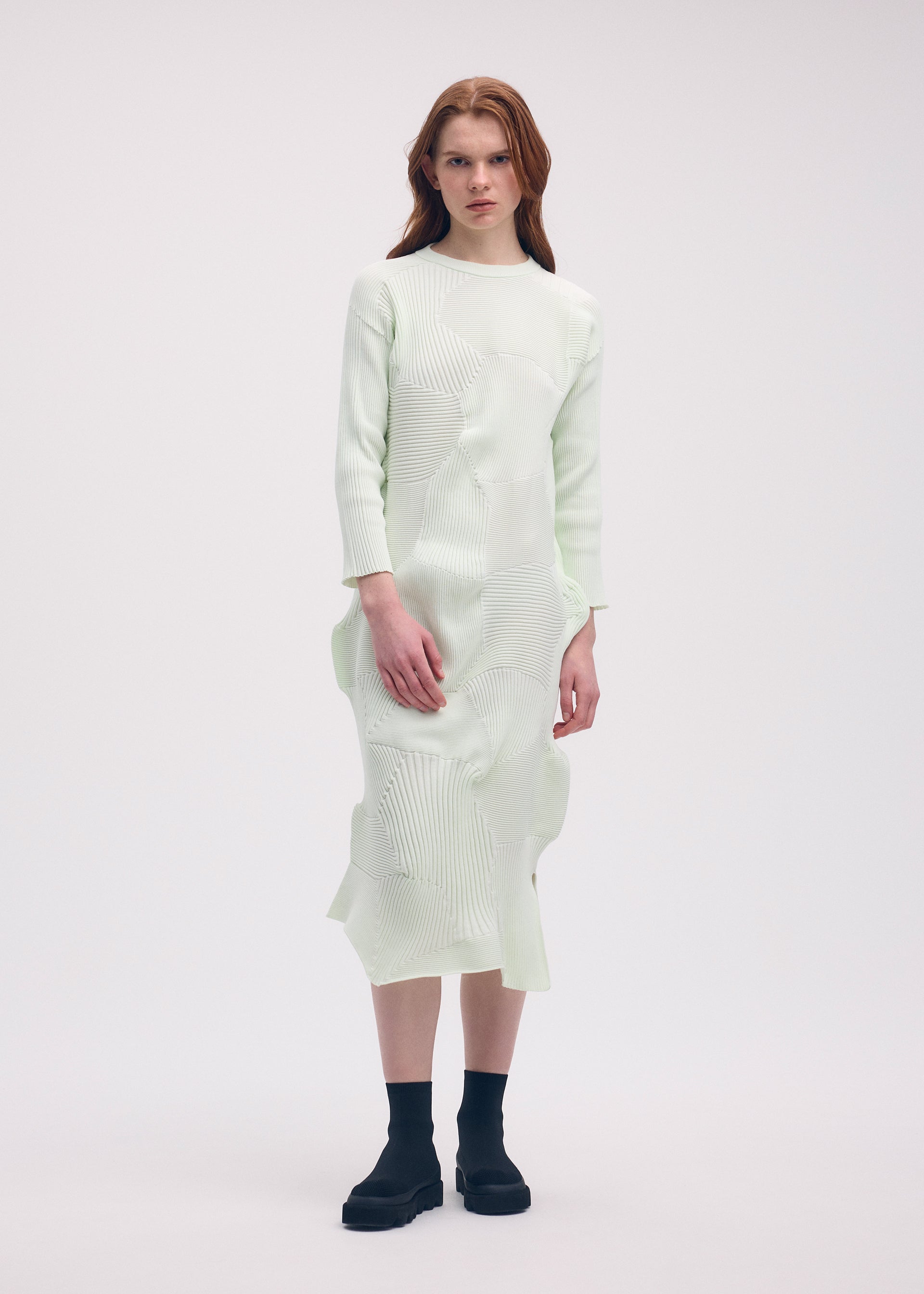 A model wears the ISSEY MIYAKE KONE KONE dress.