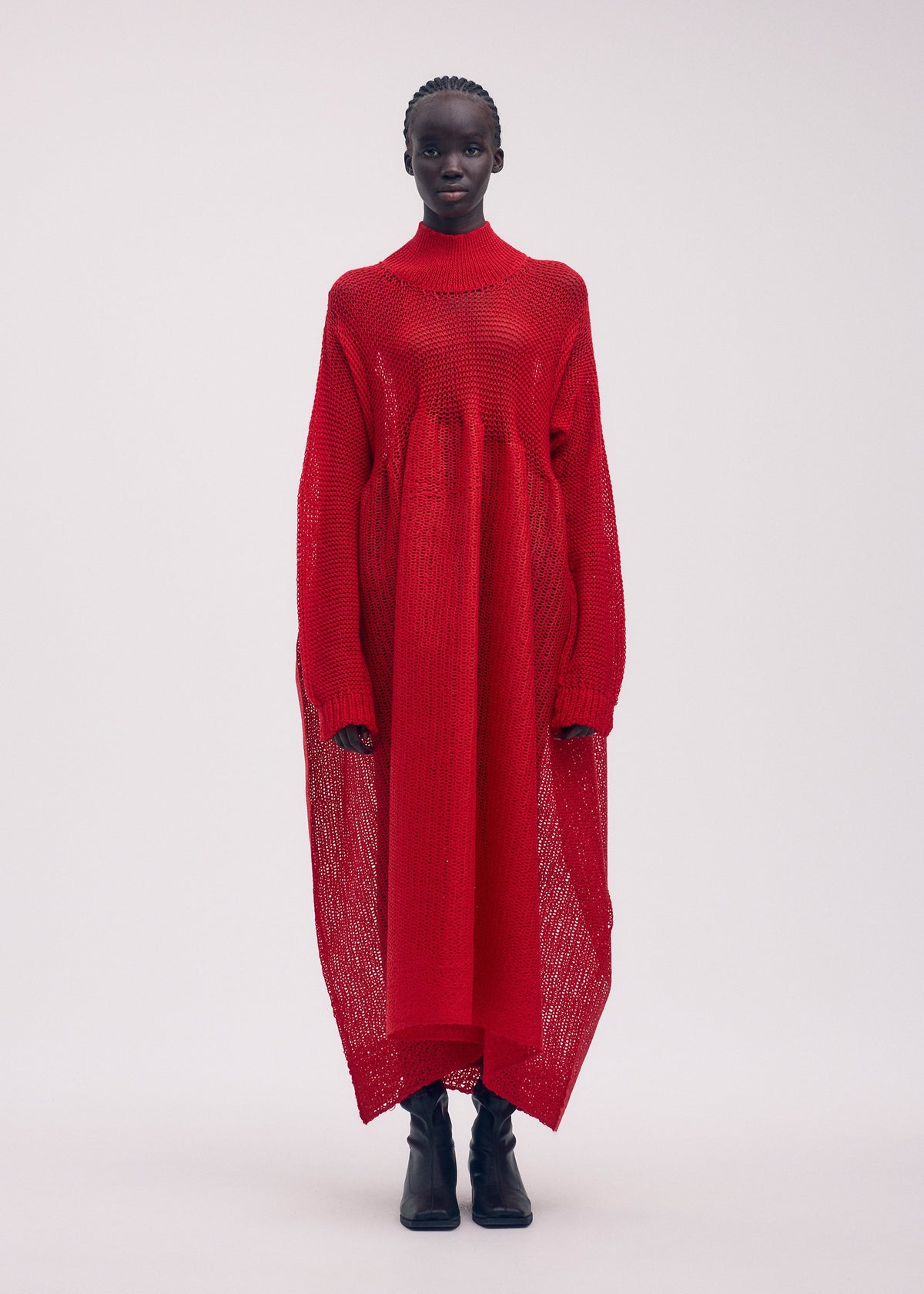 A model wears the ISSEY MIYAKE PANINI dress.