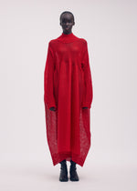 A model wears the ISSEY MIYAKE PANINI dress.
