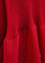 A model wears the ISSEY MIYAKE PANINI dress.