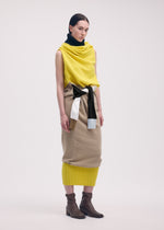 A model wears the ISSEY MIYAKE SLEEVES COLLECTION dress.