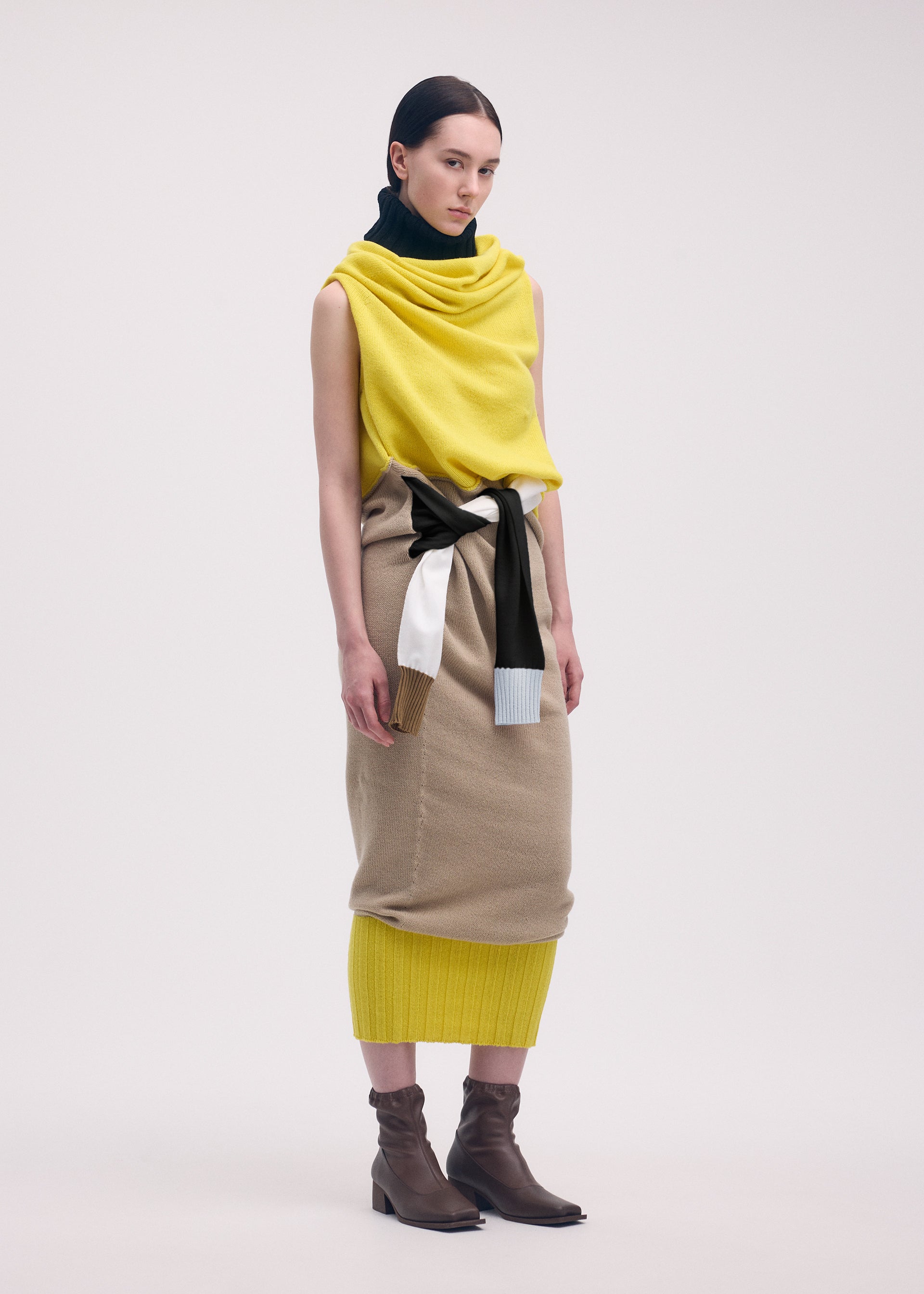 A model wears the ISSEY MIYAKE SLEEVES COLLECTION dress.