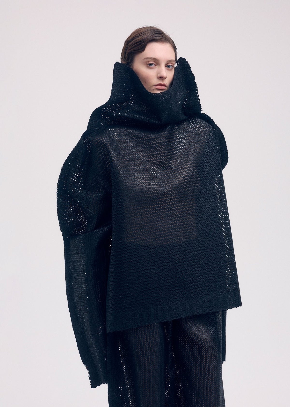 A model wears the ISSEY MIYAKE PANINI top.