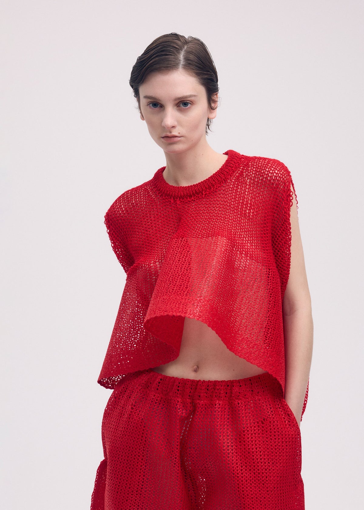 A model wears the ISSEY MIYAKE PANINI top.