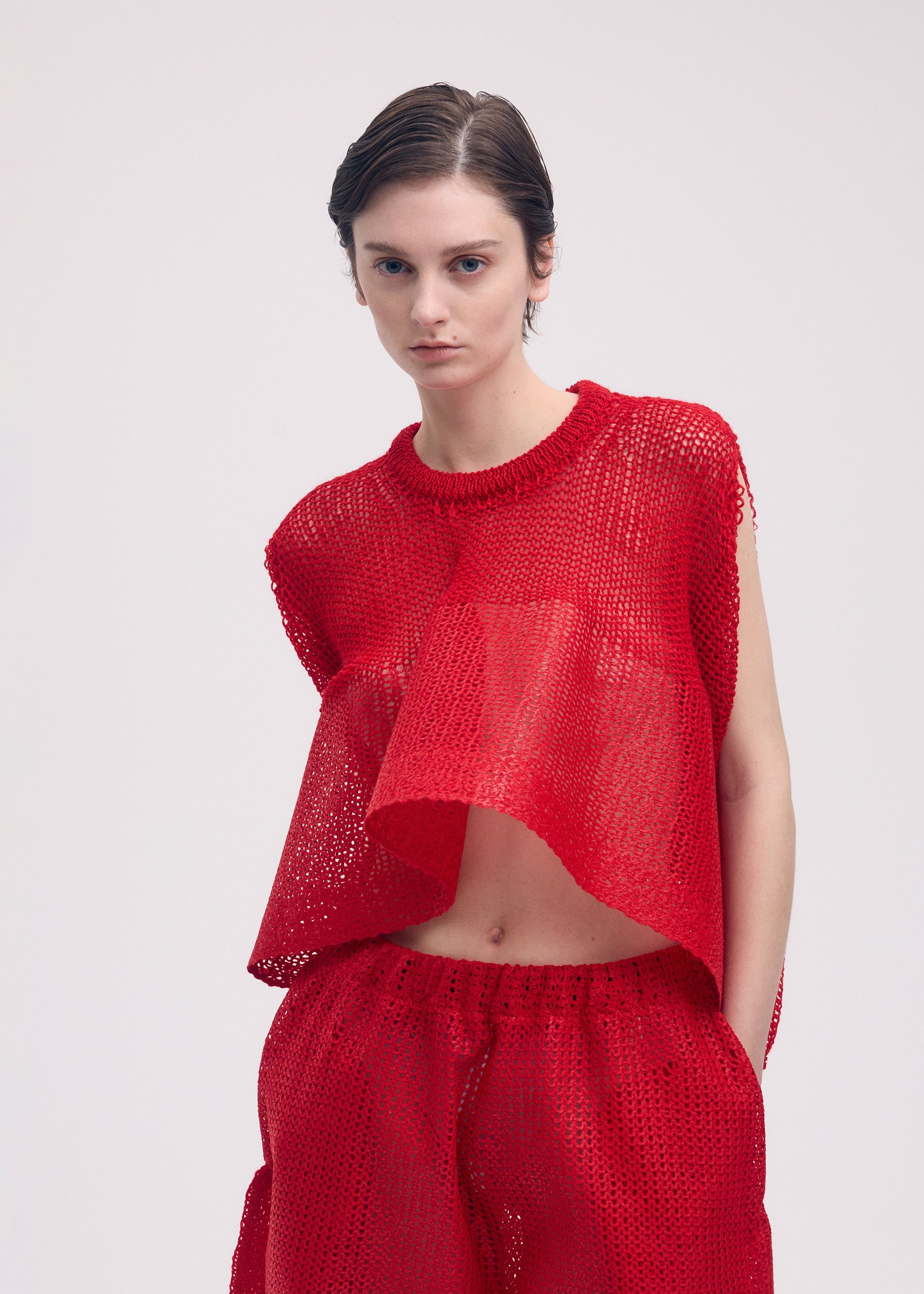A model wears the ISSEY MIYAKE PANINI top.