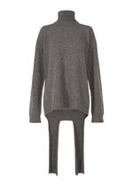 A product shot of the ISSEY MIYAKE BACKPACK KNIT top in charcoal (14).