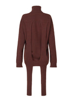 A detail shot of the ISSEY MIYAKE BACKPACK KNIT top.